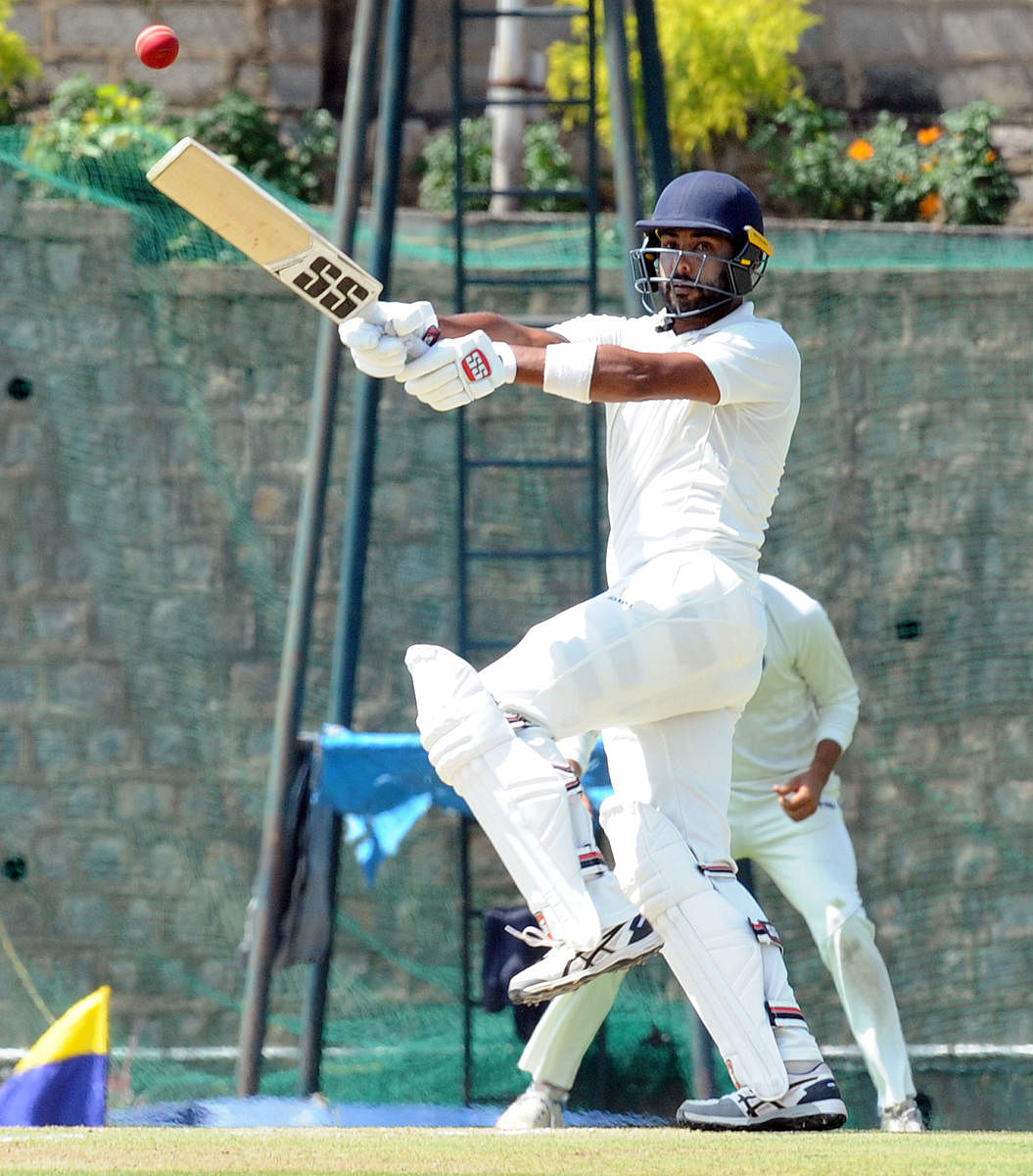 Karnataka's Stuart Binny pulls one to the fence en route his 118 against Delhi during their Ranji Trophy tie at Alur Ground in Bengaluru on Friday. DH Photo/ Srikanta Sharma R