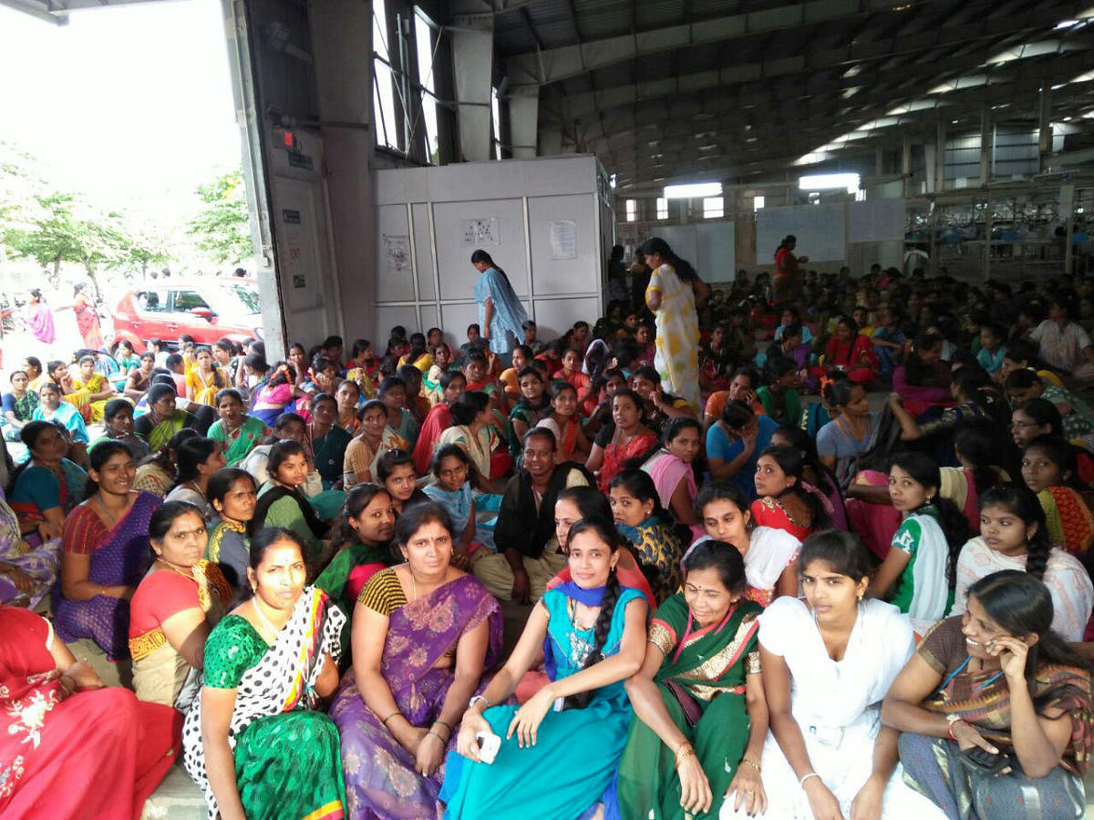 Shahi garment factory workers are seen on a protest at the factory premises in Kaggalipura, Kanakapura Main Road in Bengaluru on Friday.