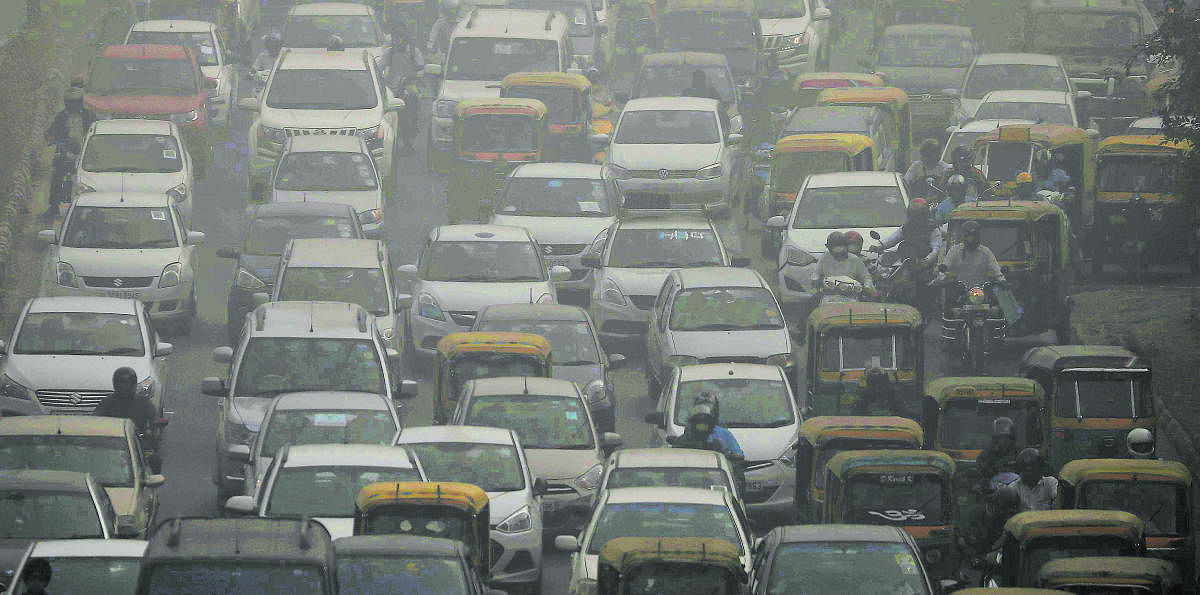 Vehicles drive through heavy smog in Delhi, India. Reuters Photo