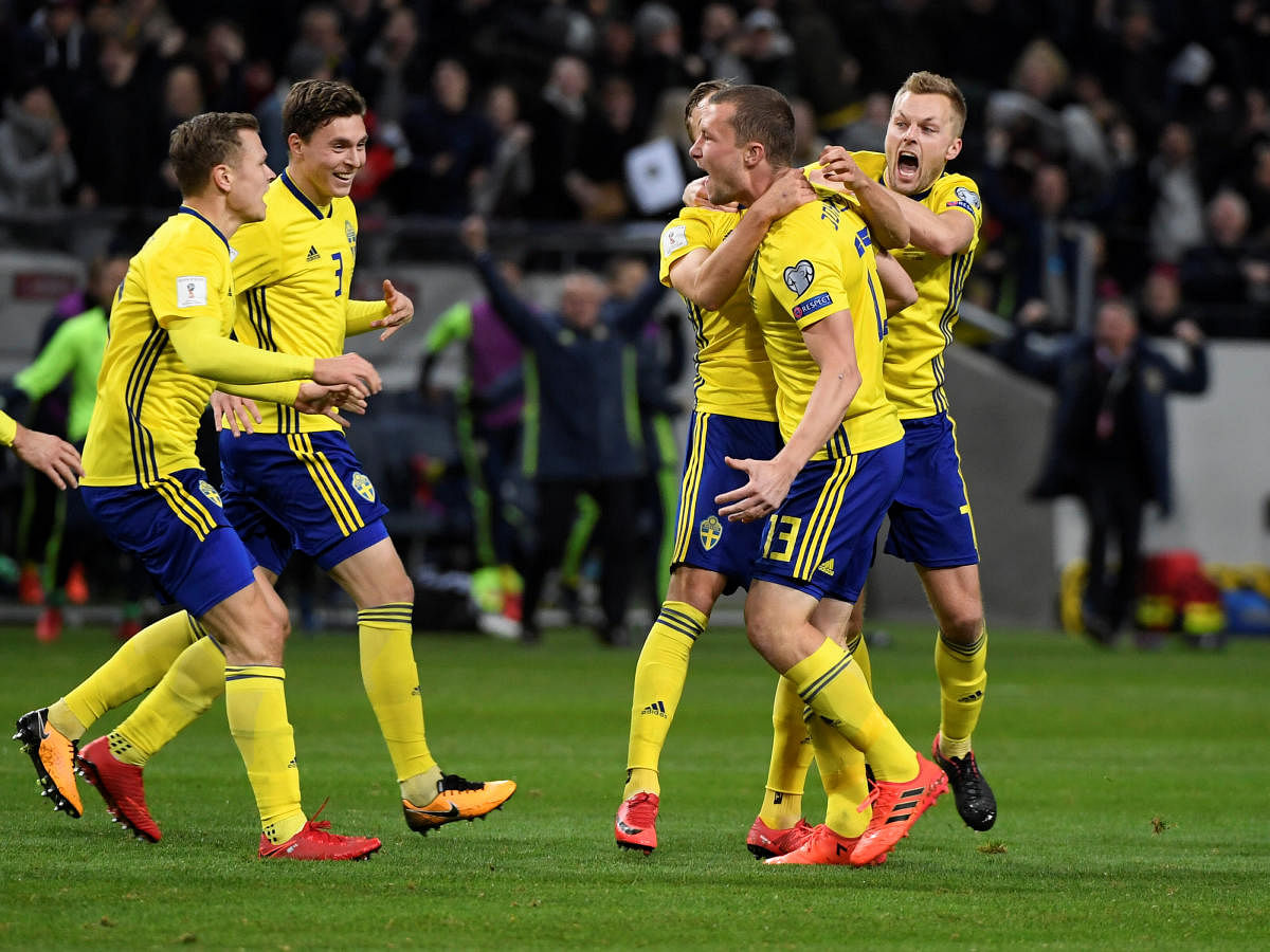 Sweden's Jakob Johansson (13) celebrates with team-mates afer scoring against Italy in Stockholm on Friday. Reuters
