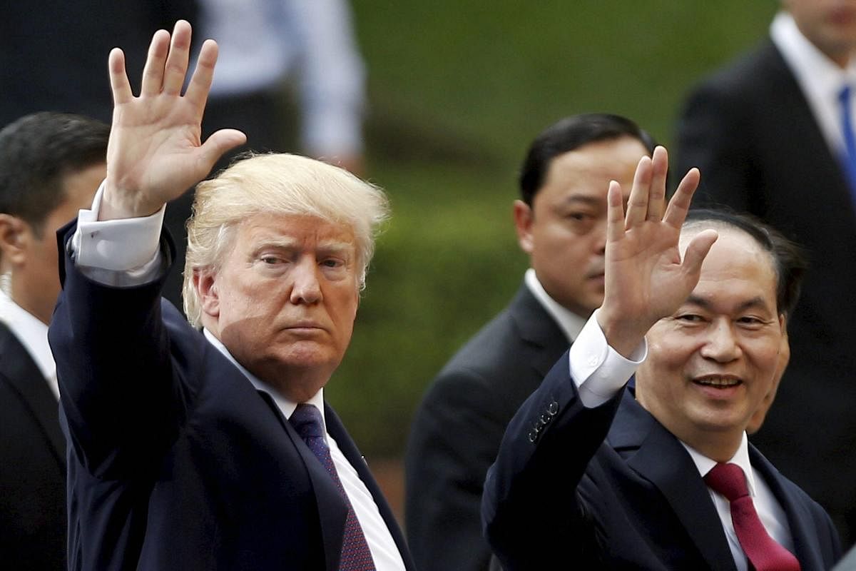 US President Donald Trump (left) and Vietnam's President Tran Dai Quang at a press conference at the Presidential Palace in Hanoi, Vietnam, on Sunday. AP photo