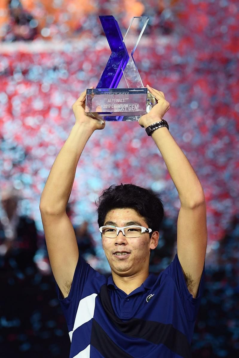 Hyeon Chung of South Korea with the trophy after defeating Andrey Rublev of Russia in the Next Gen ATP Finals in Milan on Saturday. AFP