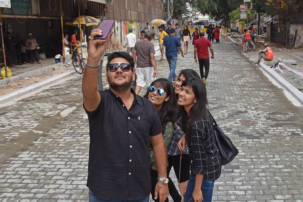 Youngsters stop for a selfie on Church Street.