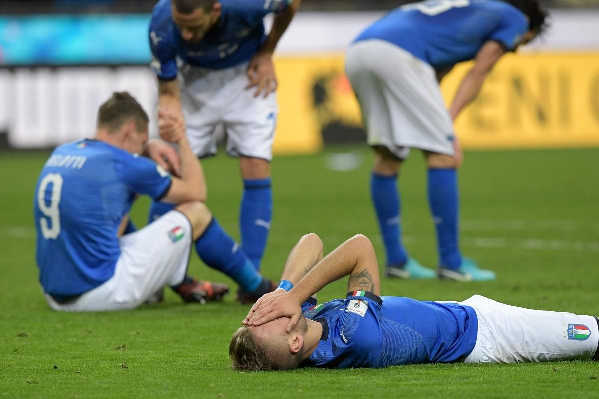 Italian players look devastated after failing to qualify for the World Cup for the first time since 1958. They lost to Sweden in the play-off. AFP