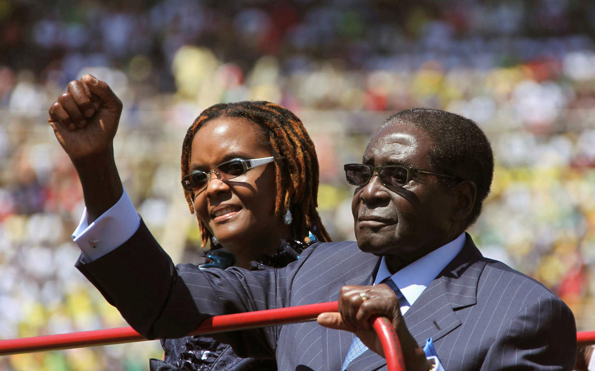 Zimbabwe President Robert Mugabe and his wife Grace arrive for his inauguration as President, in Harare August 22, 2013. REUTERS file photo