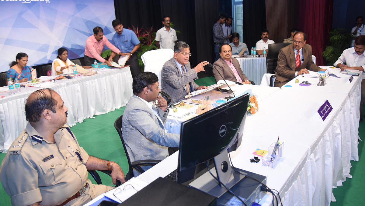 Karnataka Lokayukta Justice P Vishwanath Shetty listens to the grievances of public at Town Hall in Mangaluru on Friday. Deputy Commissioner Sasikanth Senthil and Police Commissioner T R Suresh look on among other.