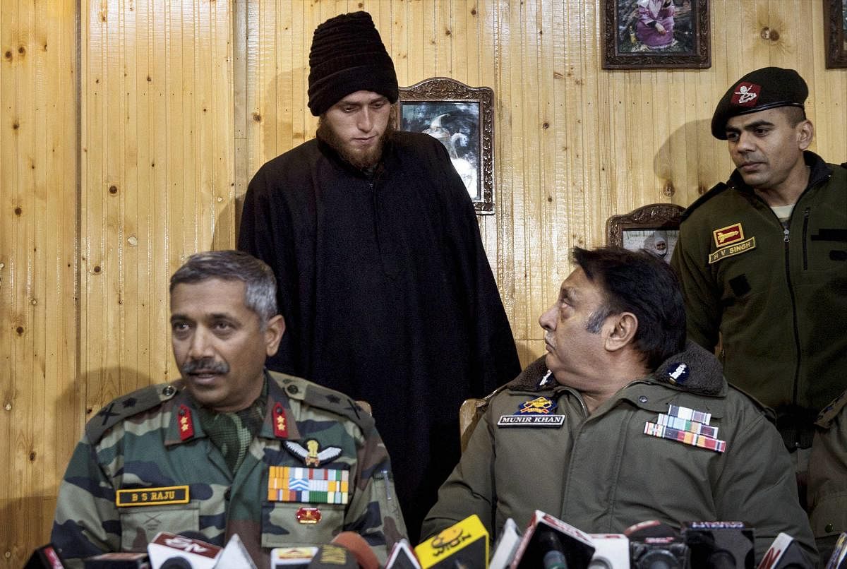 Majid Arshid being presented before the media during a joint press conference at Awantipora in Pulwama district of South Kashmir, on Friday. Arshid has surrendered before security forces. PTI