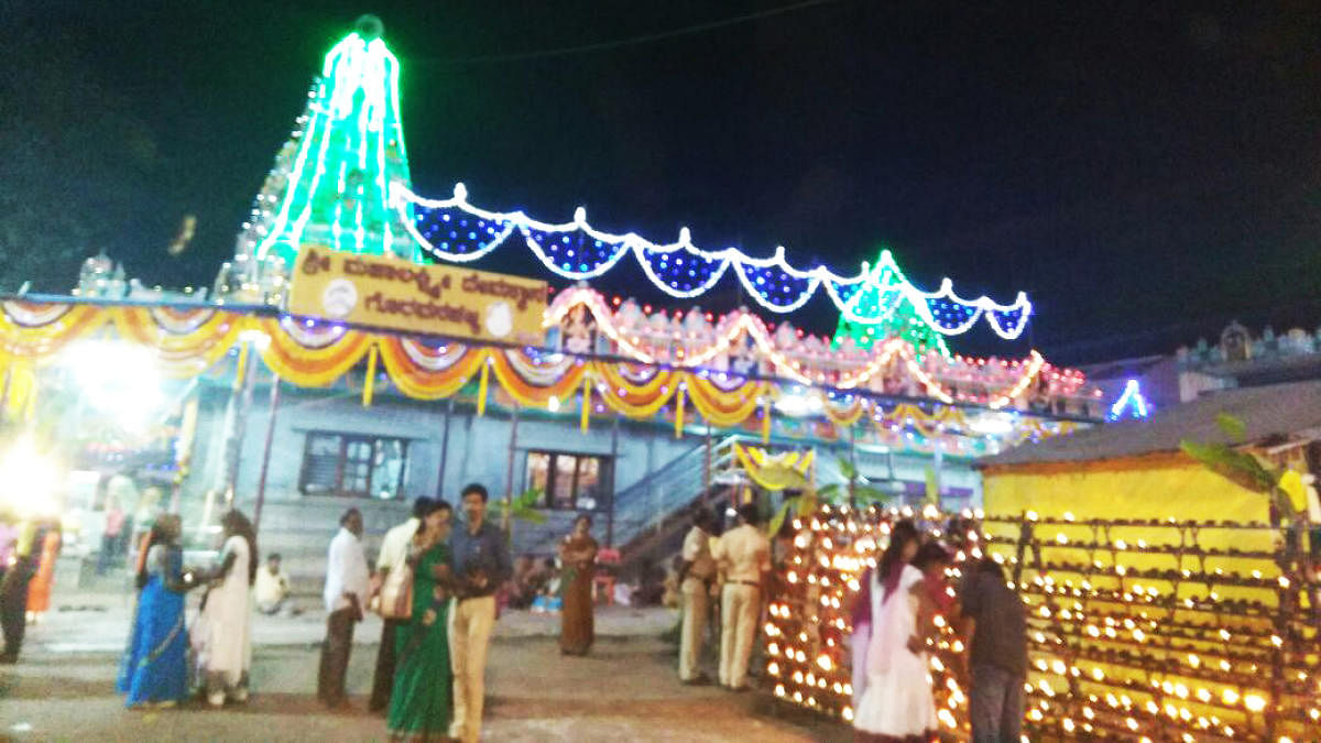 When compared to previous years, the number of devotees, who took part in Lakshadeepotsava programme, organised at Goravanahalli in Koratagere taluk on Friday. DH photo