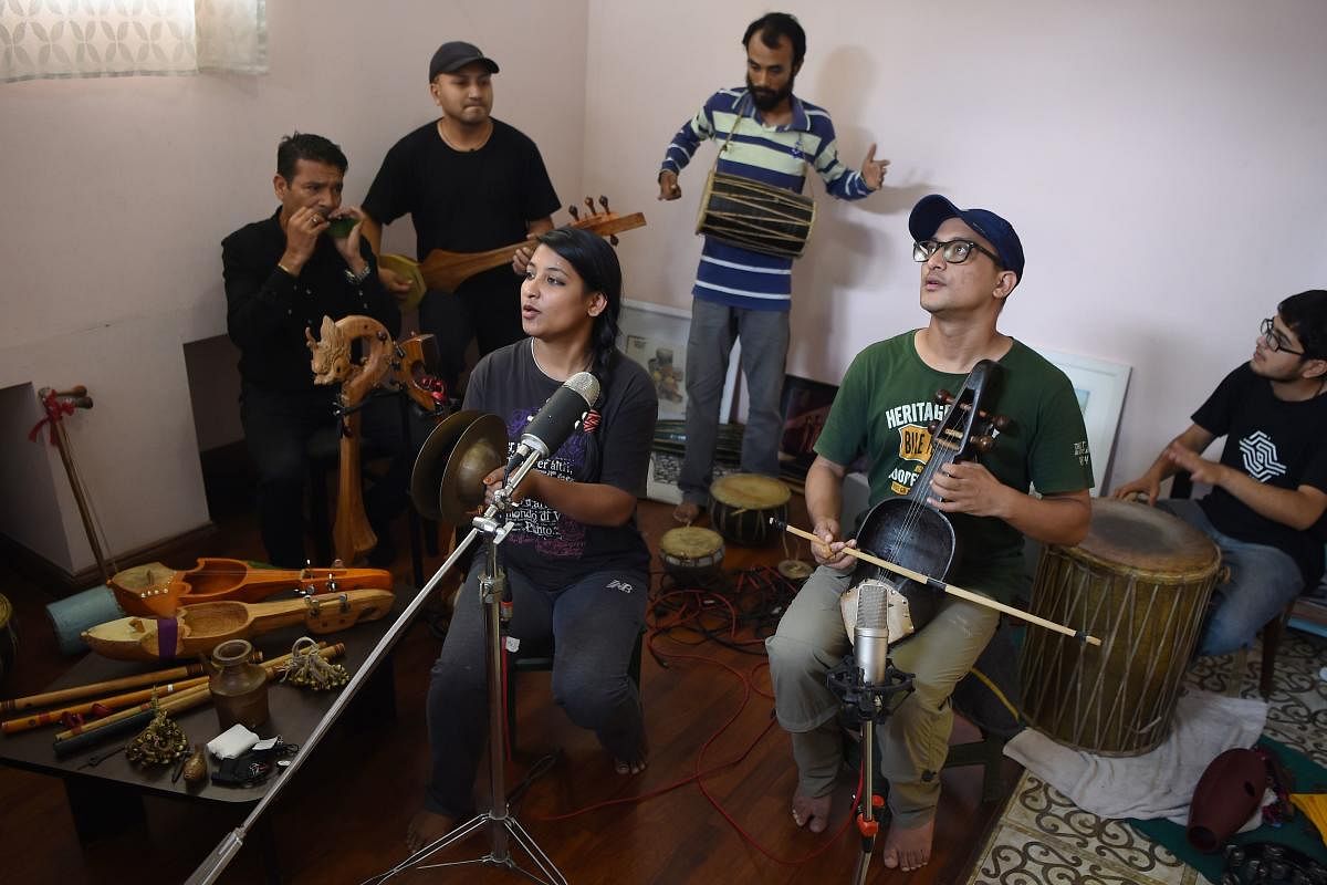 In this photograph taken on September 18, 2017, Nepali band 'Night' gather for a rehearsal during an interview with AFP in Kathmandu. Nepal's musical heritage is enjoying a revival as young musicians fuse the sounds of traditional instruments once at risk of disappearing with lyrics that examine the modern challenges facing the country. / AFP PHOTO / Prakash MATHEMA / TO GO WITH 'NEPAL-MUSIC-TRADITION',FEATURE BY PAAVAN MATHEMA