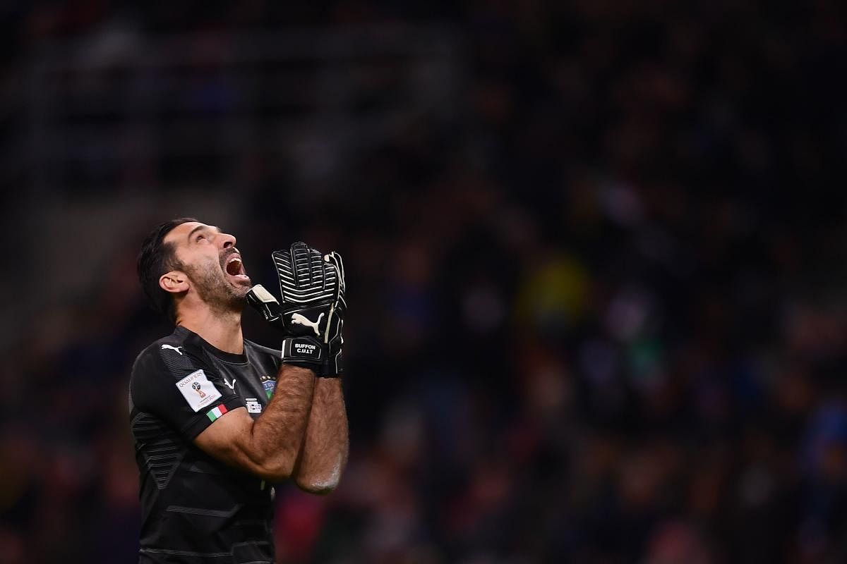 Italy's goalkeeper Gianluigi Buffon reacts during the FIFA World Cup 2018 qualification football match between Italy and Sweden, on November 13, 2017 at the San Siro stadium in Milan. / AFP PHOTO / Marco BERTORELLO
