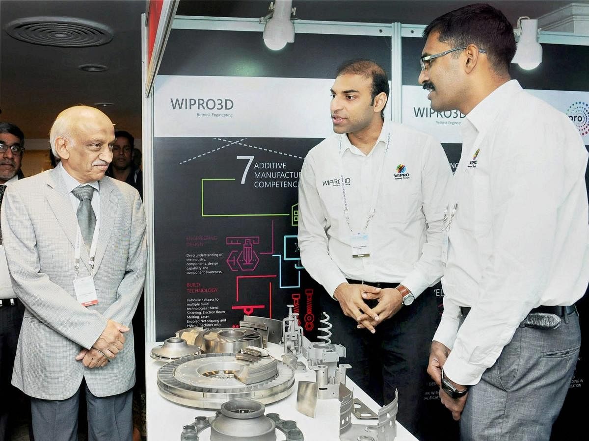 New Delhi: Secretary, Department of Space, Chairman, Space Commission and Chairman, Indian Space Research Organisation (ISRO), Kiran Kumar visiting an exhibition on space technology at the inauguration of the international seminar on 'Indian Space Programme : 'Trends and Opportunities for Industry', in New Delhi on Monday. PTI Photo / PIB (PTI11_20_2017_000115B)