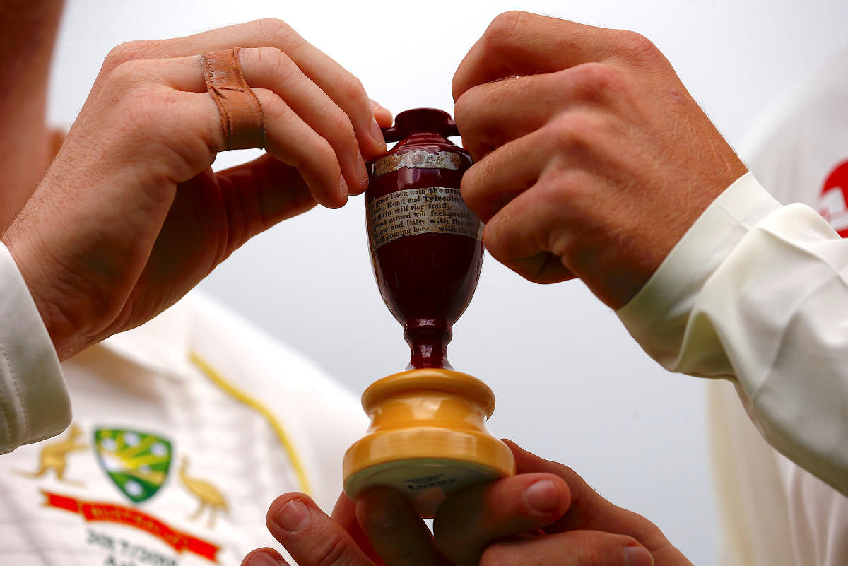 Australia captain Steve Smith and his England counterpart Joe Root holds a replica of Ashes urn during an official event ahead of the Ashes opening test match in Brisbane. The first Ashes Test will be at the GABBA from Thursday. Reuters