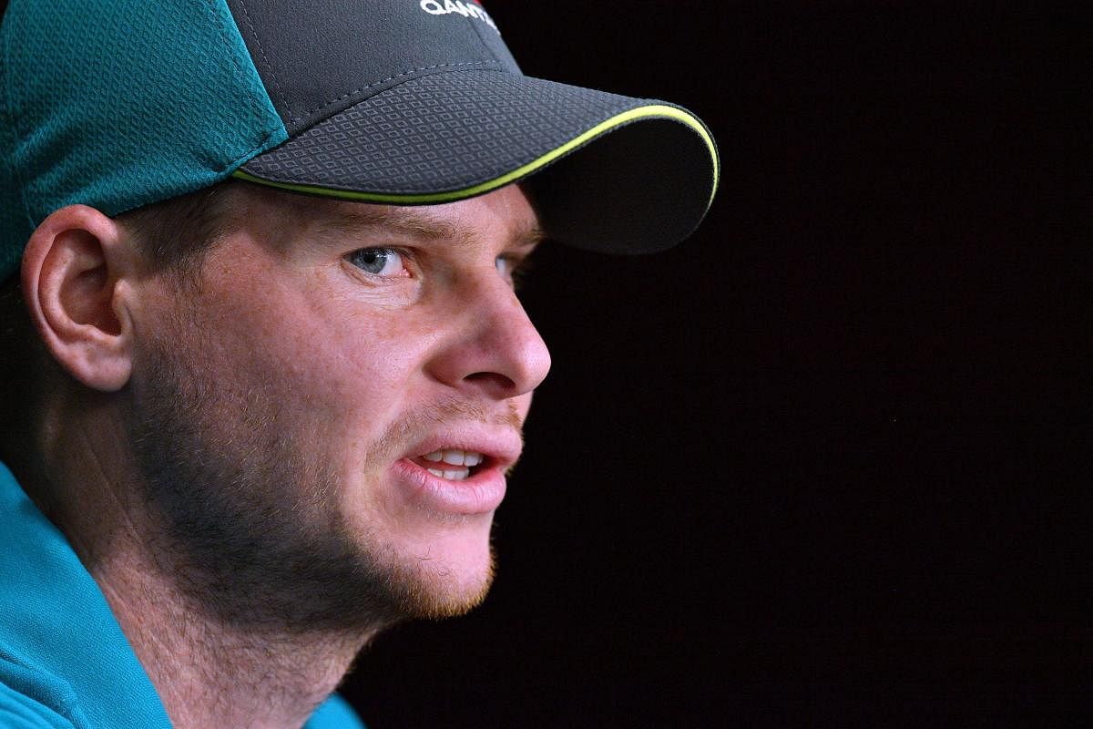 Australia cricket team captain Steve Smith speaks at a press conference in Brisbane on November 22, 2017, ahead of the first Test of the Ashes Series. / AFP PHOTO / SAEED KHAN / -- IMAGE RESTRICTED TO EDITORIAL USE - STRICTLY NO COMMERCIAL USE --