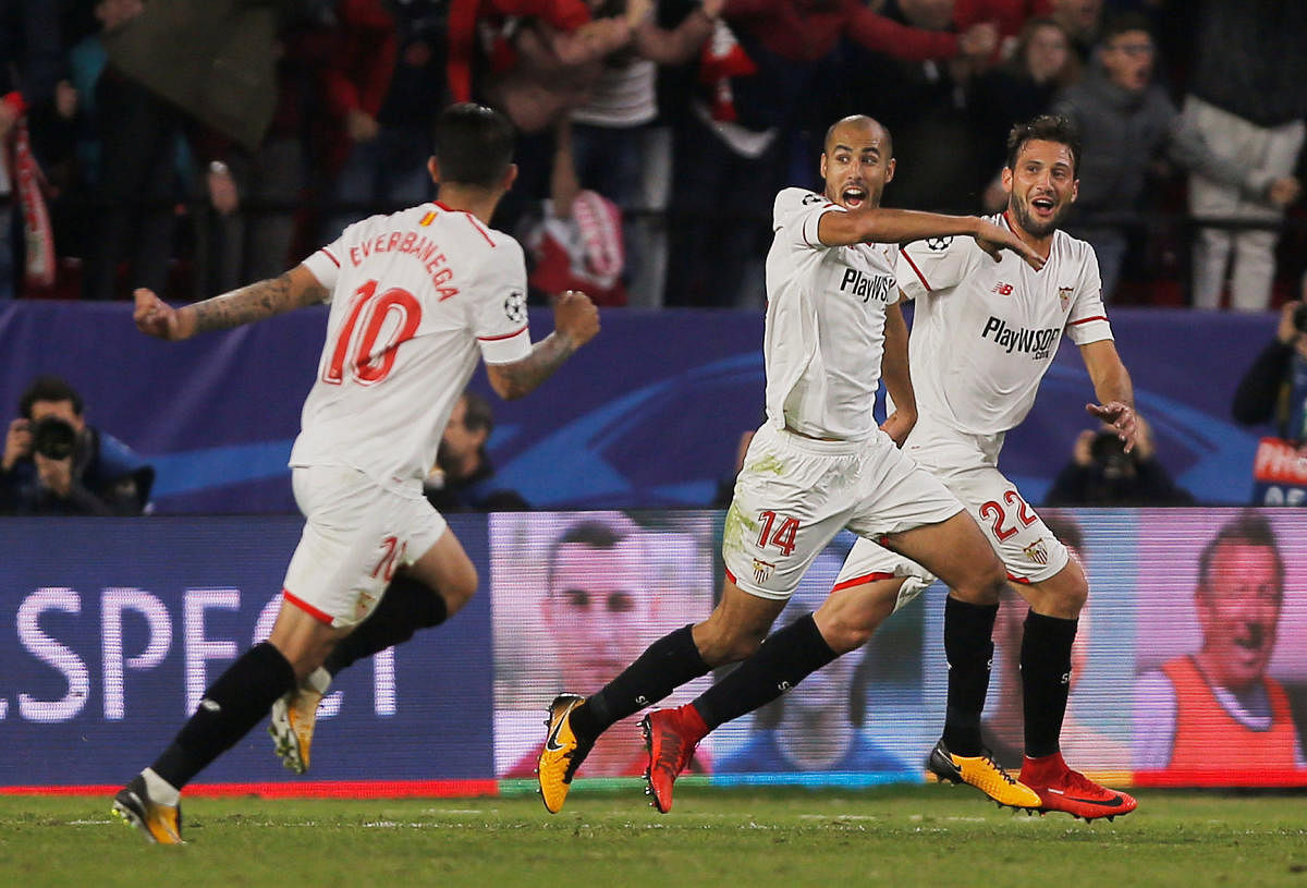 No stopping them Sevilla's Guido Pizarro (centre) celebrates after scoring a injury time equaliser against Liverpool on Tuesday. Reuters
