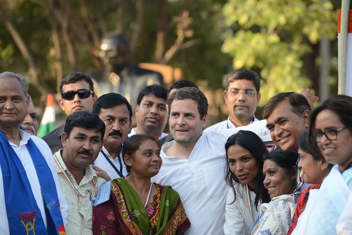 Congress vice-president Rahul Gandhi poses with members of the Dalit community during his visit to Dalit Shakti Kendra (DSK), at Nani Devti village, near Ahmedabad on Friday. AFP