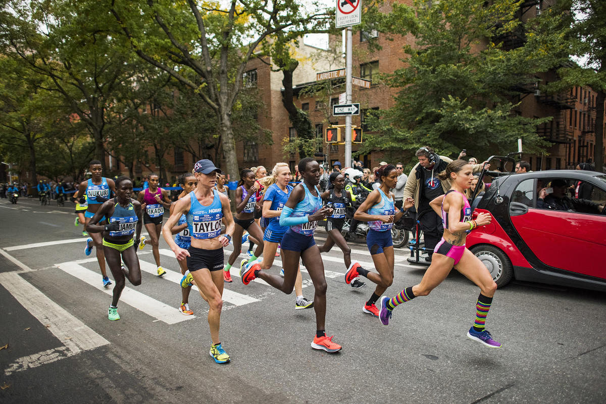 A pack of women runners on Brooklyn's Lafayette Avenue during the 2017 New York City Marathon in New York, Nov. 5, 2017. (Joshua Bright/The New York Times)