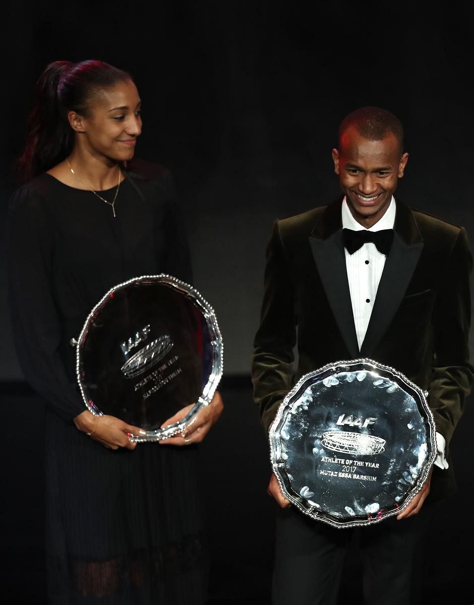 PROUD MOMENT High jumper Mutaz Essa Barshim (right) of Qatar and Belgium's heptathlete Nafissatou Thiam with their trophy after being awarded the male and female athletes of the year. AFP
