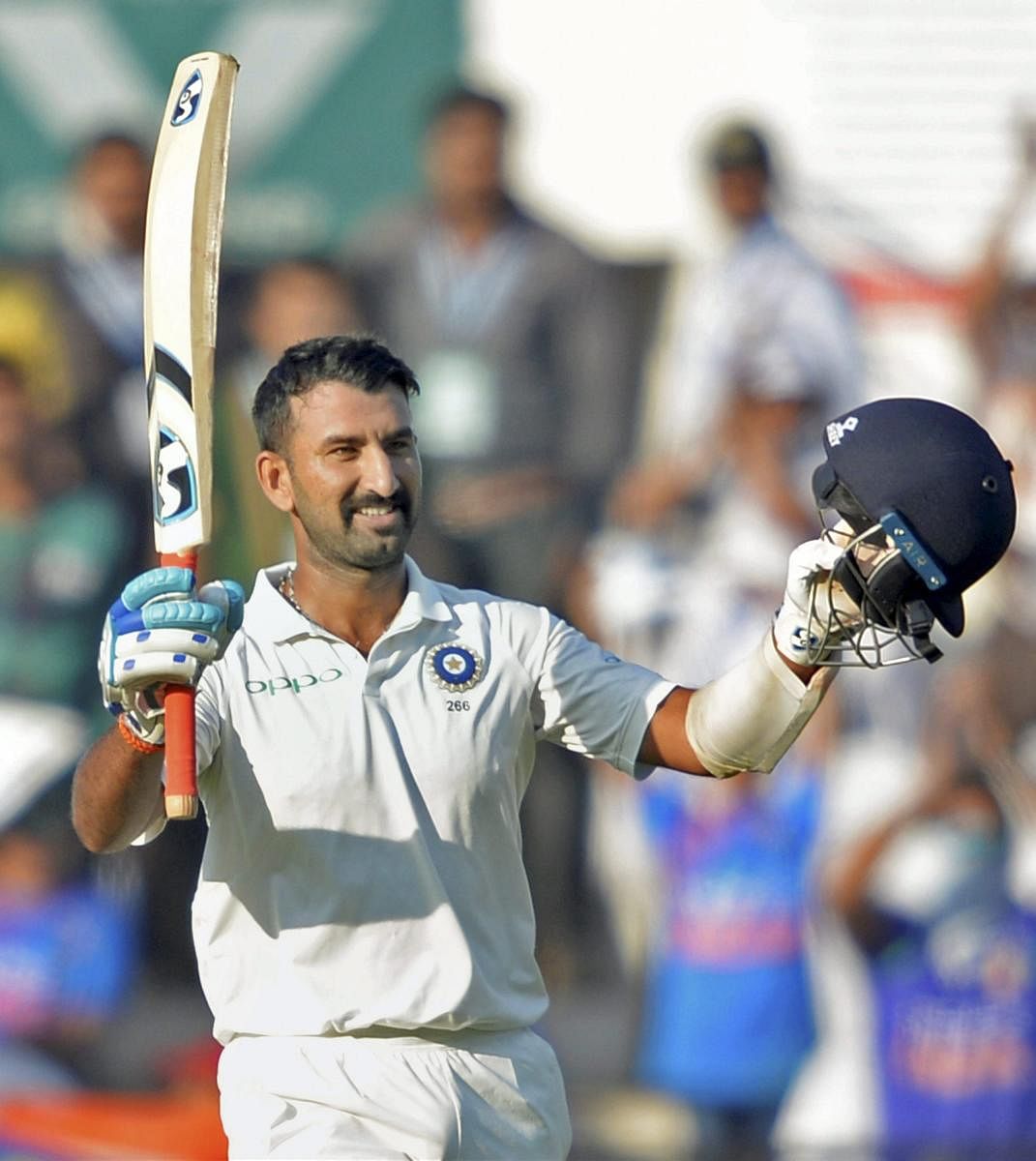 Cheteshwar Pujara celebrates his century on the second day of the second Test match against Sri Lanka in Nagpur on Saturday. PTI Photo