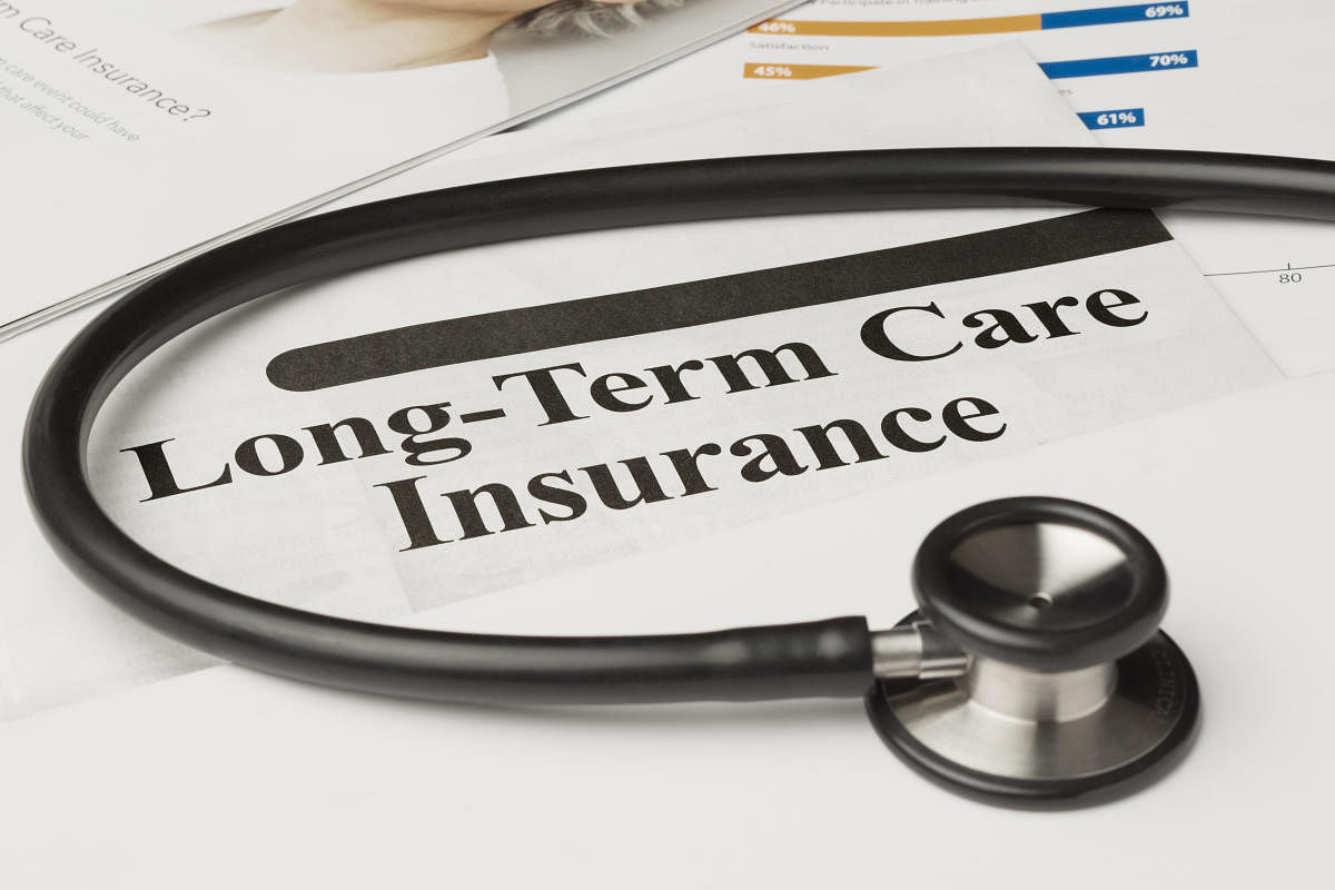 Long-term care insurance information, form and stethoscope.Term insurance