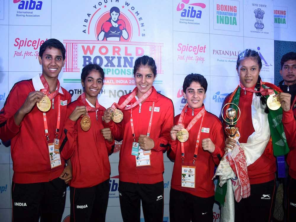 (Left to Right) Indian Gold medalists boxers Sashi Chopra,Nitu, Sakshi, Jyoti and Ankushita Boro posing for a photograph during the AIBA Youth Women's World Boxing Championship 2017 at Nabin Chandra Bordoloi Indoor Stadium, in Guwahati on Sunday. India finished the World Women's Youth Championships tournament with five gold medals. PTI Photo