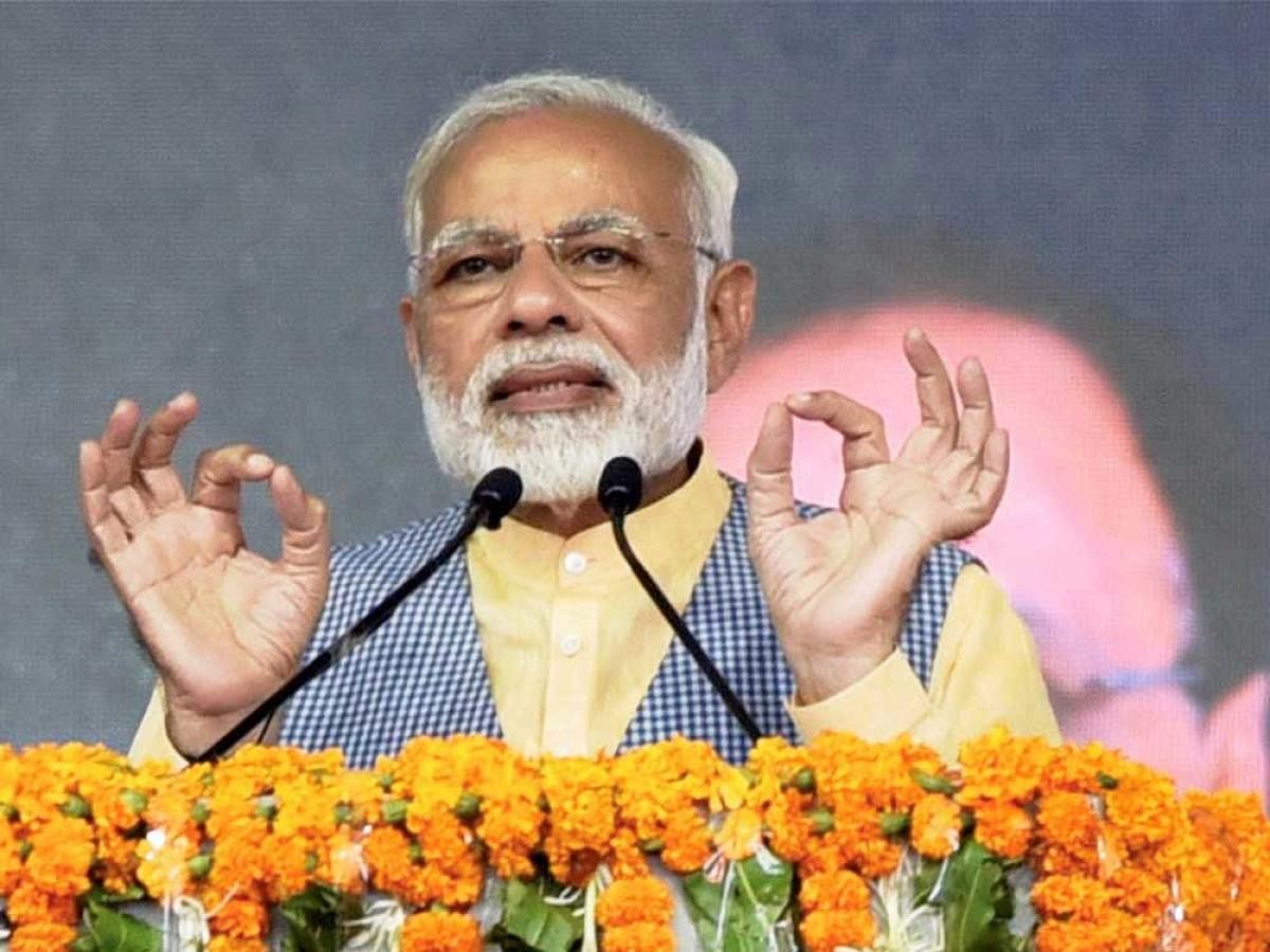 In a stinging attack on the Congress in poll-bound Gujarat, Prime Minister Narendra Modi today said the upcoming Assembly election is a fight between trust on the development and dynastic politics. PTI file photo