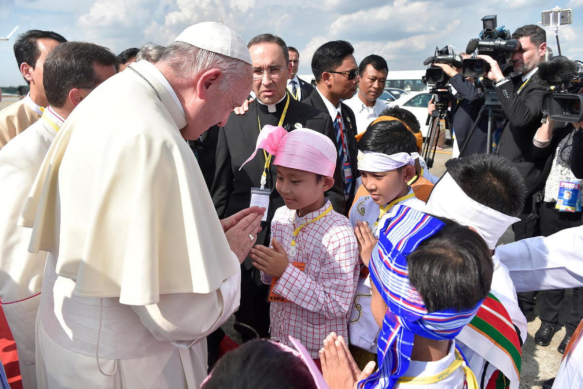 Pope Francis is welcomed as he arrives at Yangon International Airport, Myanmar November 27, 2017. Reuters