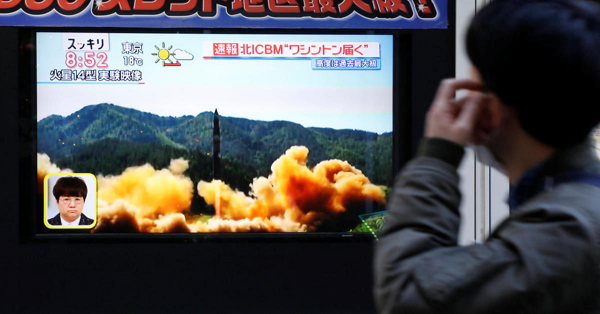 A man looks at a street monitor showing a news report about North Korea's missile launch, in Tokyo, Japan. Reuters