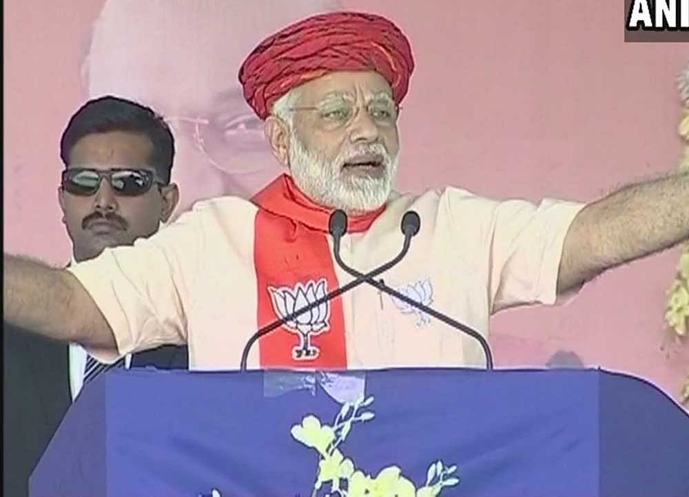Resuming his campaign for the assembly polls in his home state, Modi also accused the Congress of taking credit and political mileage over minor schemes. Image courtesy: @ANI Twitter