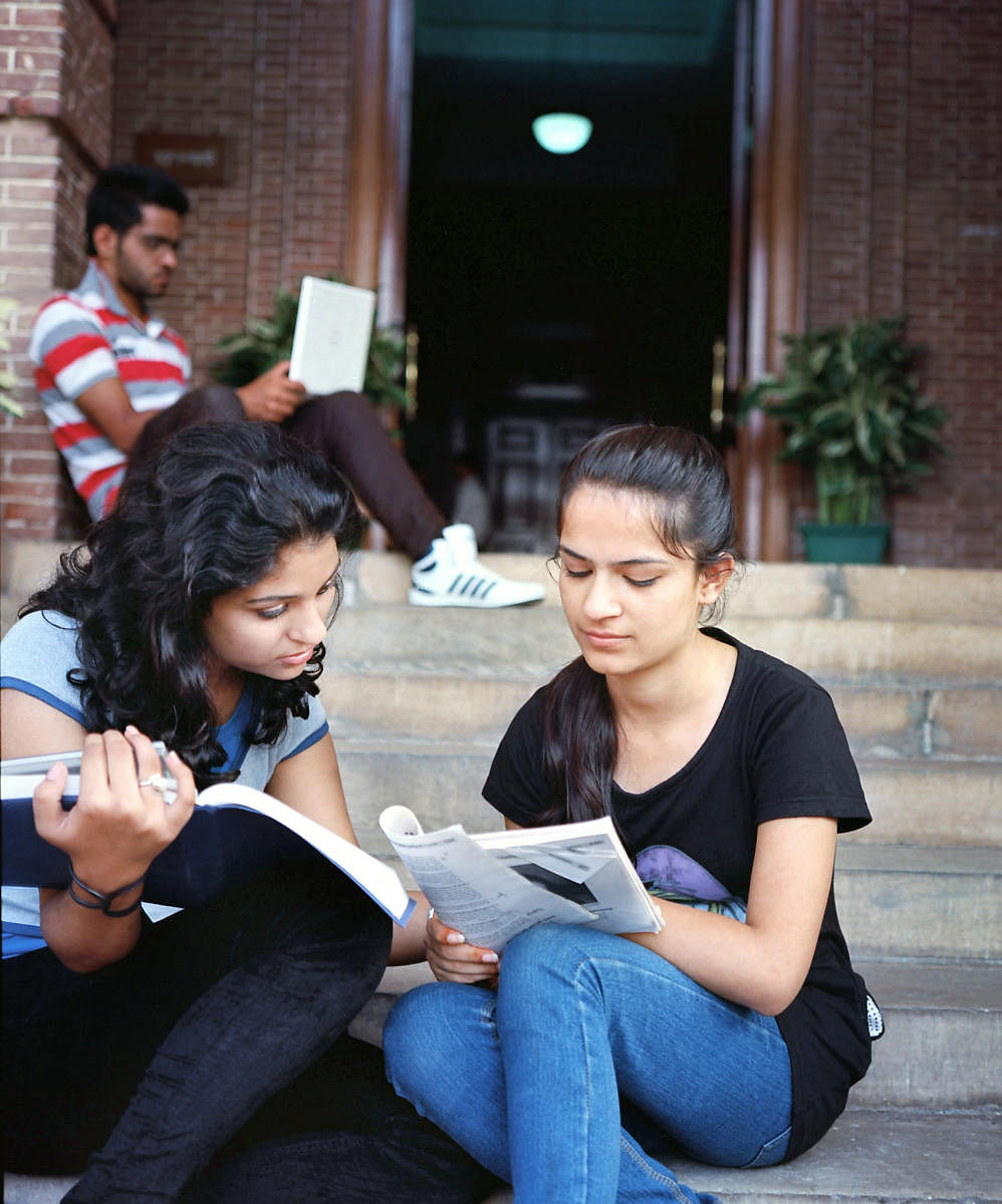Group of Ethnic Indian / Asian college students studying in the campus.Study in India