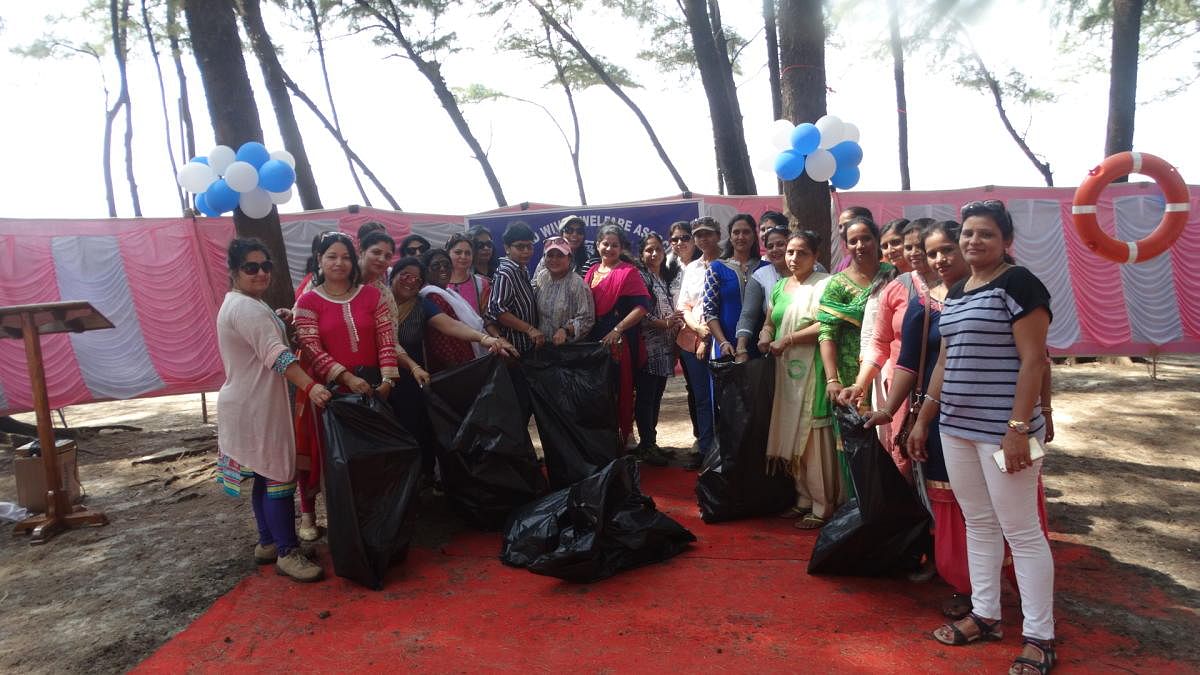 Tatrakshika members with the garbage collected as a part of cleanliness drive at Thannirbhavi beach on Wednesday.