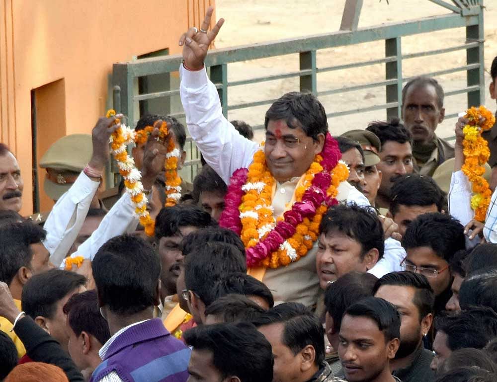 BJP candidate Vijay Arya Bandhu celebrates the party's victory at the UP Civic Elections in Mathura on Friday. PTI