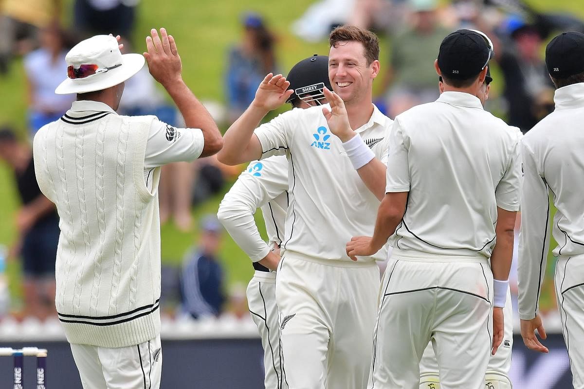 GOT HIM! New Zealand's Matt Henry (C) celebrates after dismissing a West Indies batsman on the third day of the first Test in Wellington on Monday. AFP