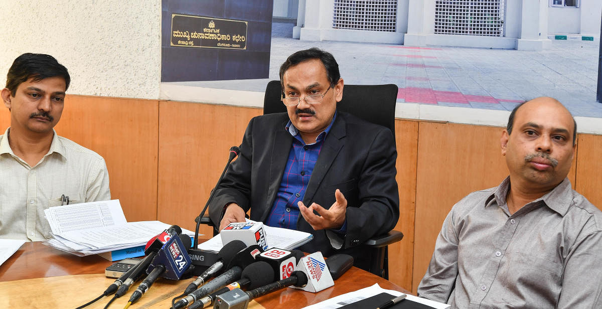 Chief Electoral Officer (Karnataka) Sanjeev Kumar shares details of the revised electoral rolls at a press conference in Bengaluru on Monday. Joint Chief Electoral Officer K N Ramesh (left) and Deputy Chief Electoral Officer Raghavendra V are seen. DH Photo.