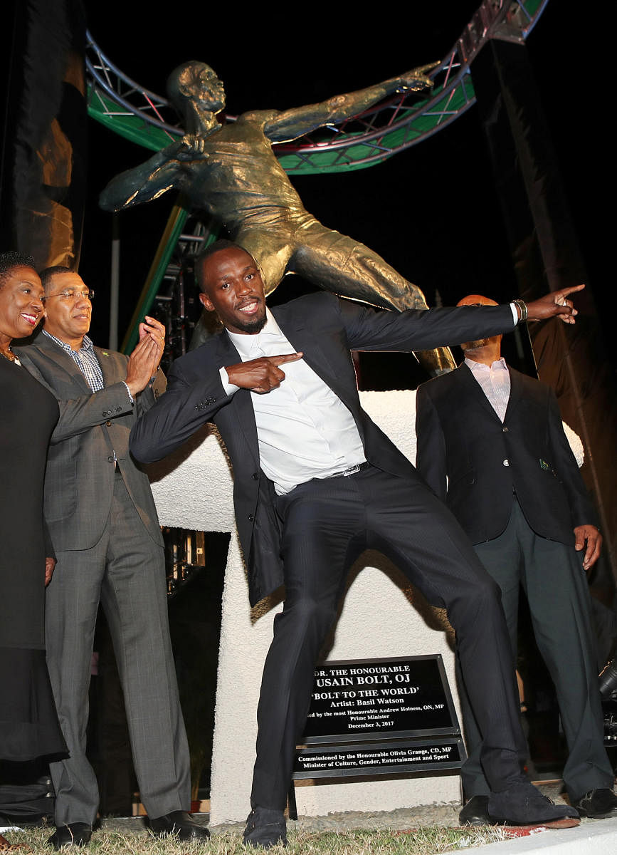 Usain Bolt poses after the unveiling of his statue at the Statue Park at the National Stadium in Kingston, Jamaica, on Sunday. Reuters