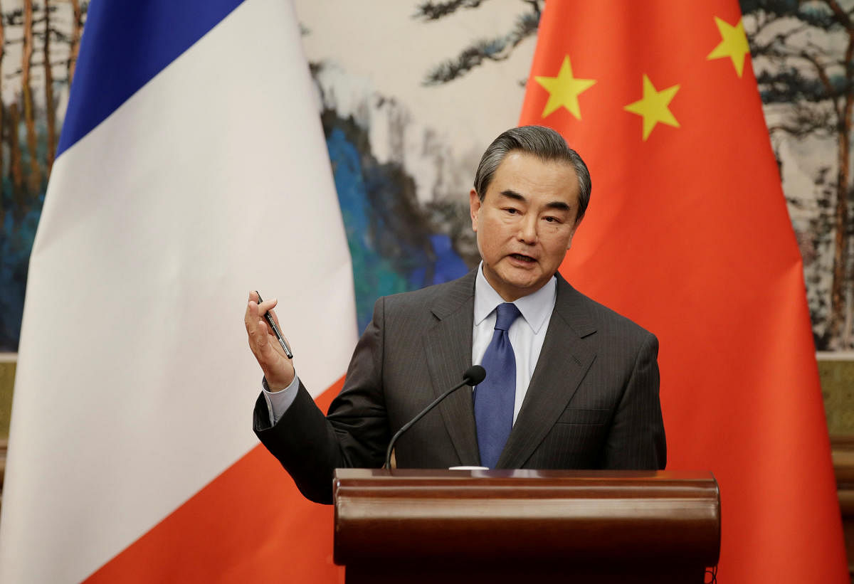 China's Foreign Minister Wang Yi attends a news conference at Diaoyutai State Guesthouse in Beijing. REUTERS