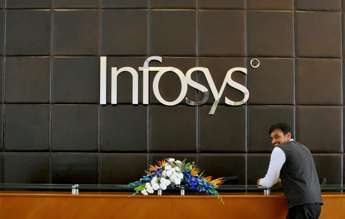 A Infosys employee stands at the front desk of its headquarters in Bengaluru, India, April 15, 2016. REUTERS/Abhishek N. Chinnappa/File photo ABHISHEK CHINNA