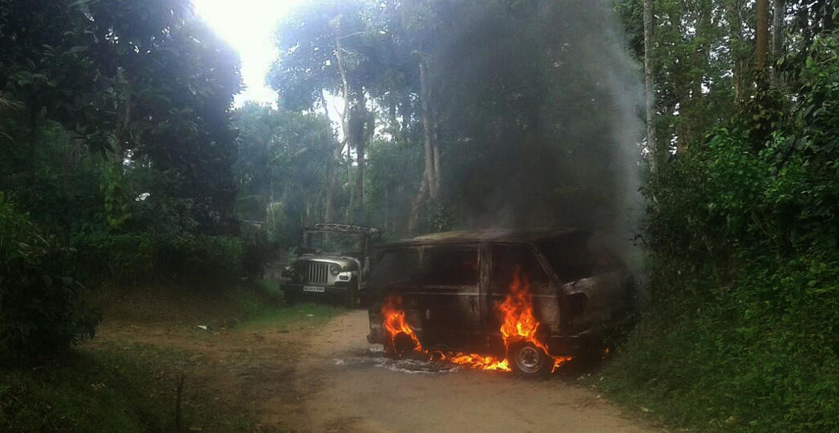 Two vehicles were torched following a fight between brothers at Siddapur on Thursday.