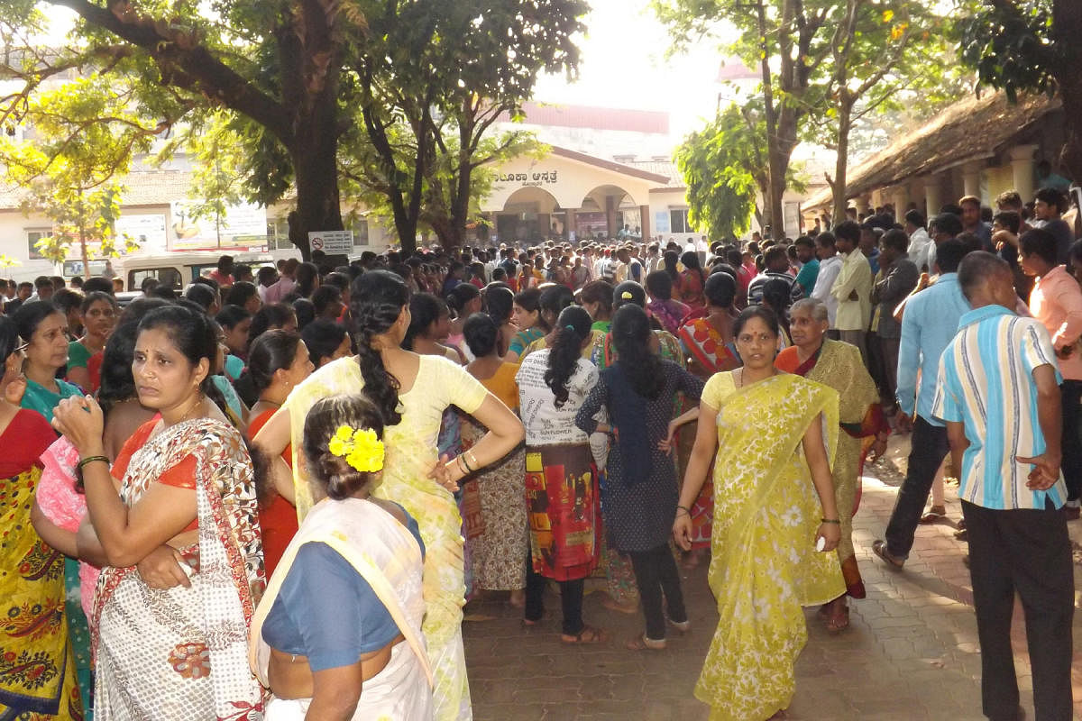 Protesters gather in front of the taluk hospital in Honnavar on Friday. DH photo