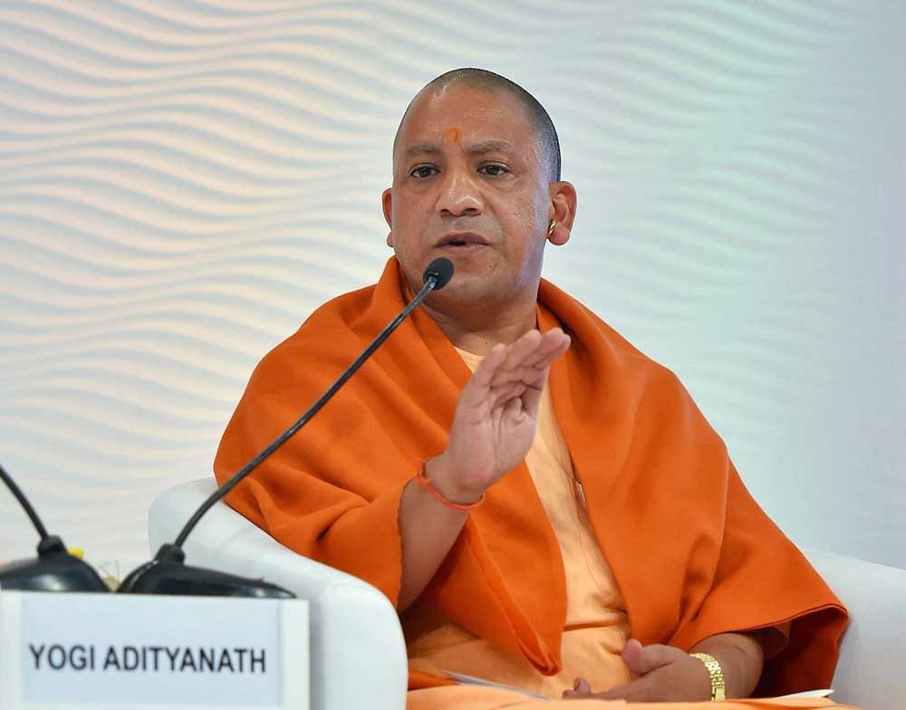Neetu Singh, president of the anganwadi workers' association in Sitapur district had garlanded the picture of Adityanath in a  mock wedding. PTI File Photo