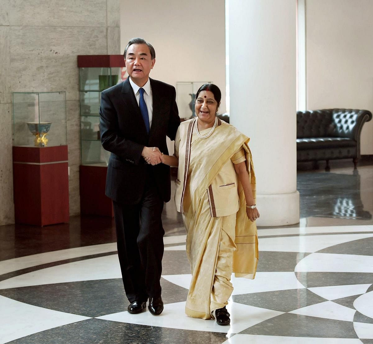 Minister for External Affairs Sushma Swaraj and her Chinese counterpart Wang Yi, before a meeting in New Delhi on Monday. PTI