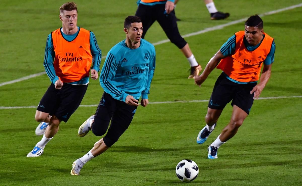 Real Madrid's Cristiano Ronaldo (centre) during a training session in Abu Dhabi. AFP