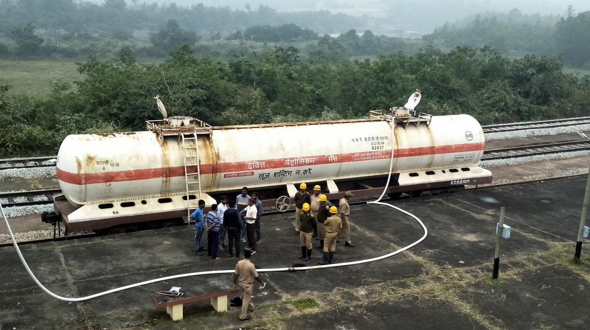 MRPL officials take measures to check leakage from a gas tanker at Sakleshpur railway station in Hassan district on Tuesday.