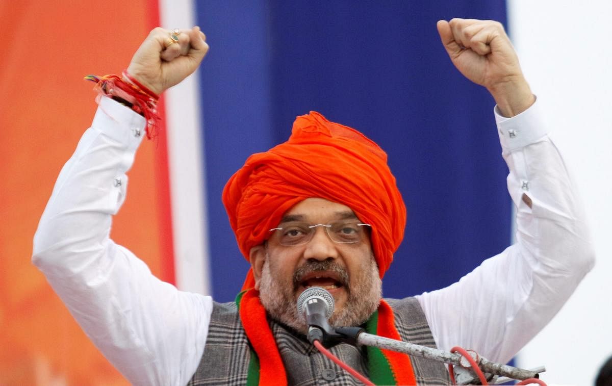 'We want to ask respected Manmohan Singh ji why was he not angry and anguished when a CM of his country was called Maut Ka Saudagar'. Why is he still silent when PM of his country is called neech,' Shah said in series of tweets. PTI photo