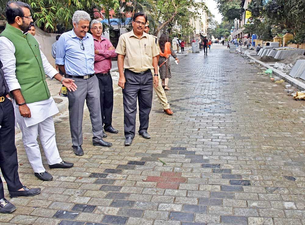 MLA N A Haris, BBMP officials inspects Church street Tender SURE work in Bengaluru on Thursday. DH Photo by S K Dinesh
