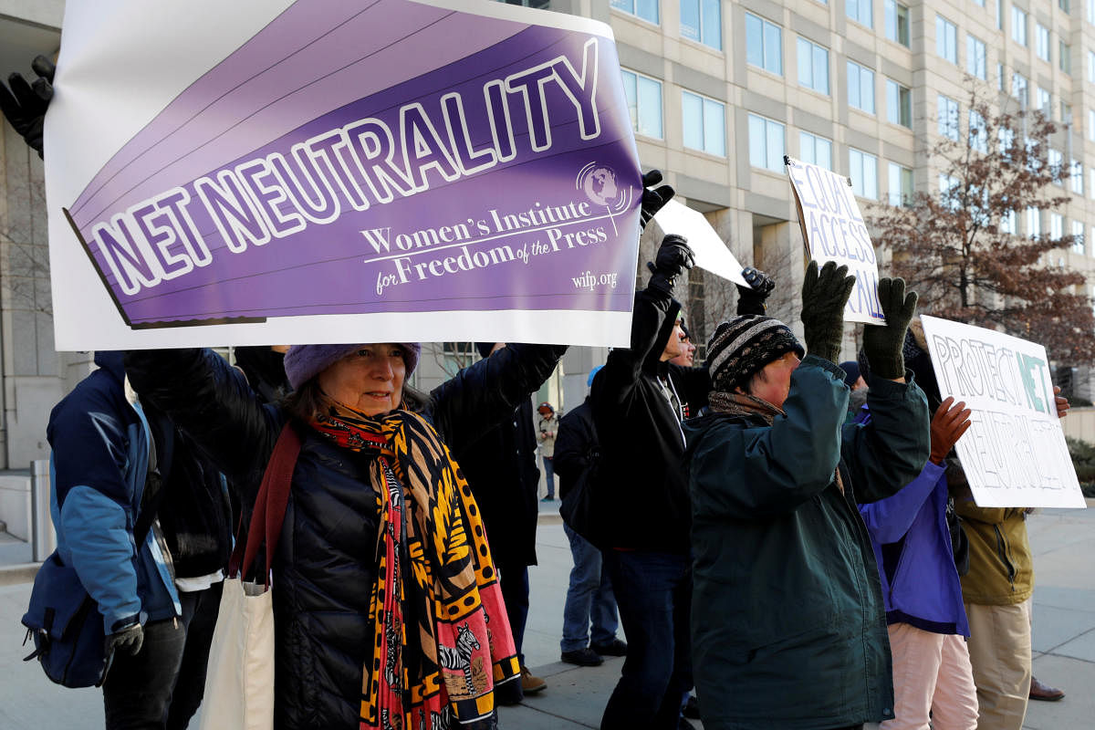 Net neutrality advocates rally in front of the Federal Communications Commission (FCC) ahead of Thursday's expected FCC vote repealing so-called net neutrality rules in Washington, U.S., December 13, 2017. REUTERS/Yuri Gripas