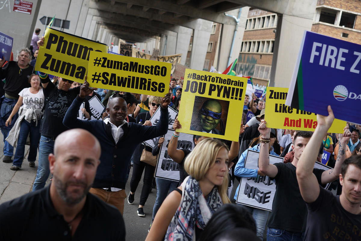 Some of the tens of thousands of South Africans protesting against President Jacob Zuma, in Johannesburg, April 7, 2017. The abrupt dismissal of Pravin Gordhan, a popular finance minister regarded as a bulwark against patronage and corruption, has touched off South Africa's largest protests in years. (Joao Silva/The New York Times)