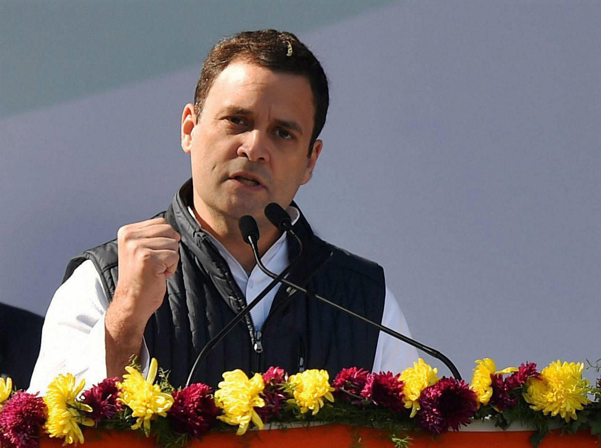 Newly elect Congress president Rahul Gandhi addresses the gathering during a grand elevation event held at the lawns of the All India Congress Committee (AICC) in New Delhi on Saturday. PTI Photo