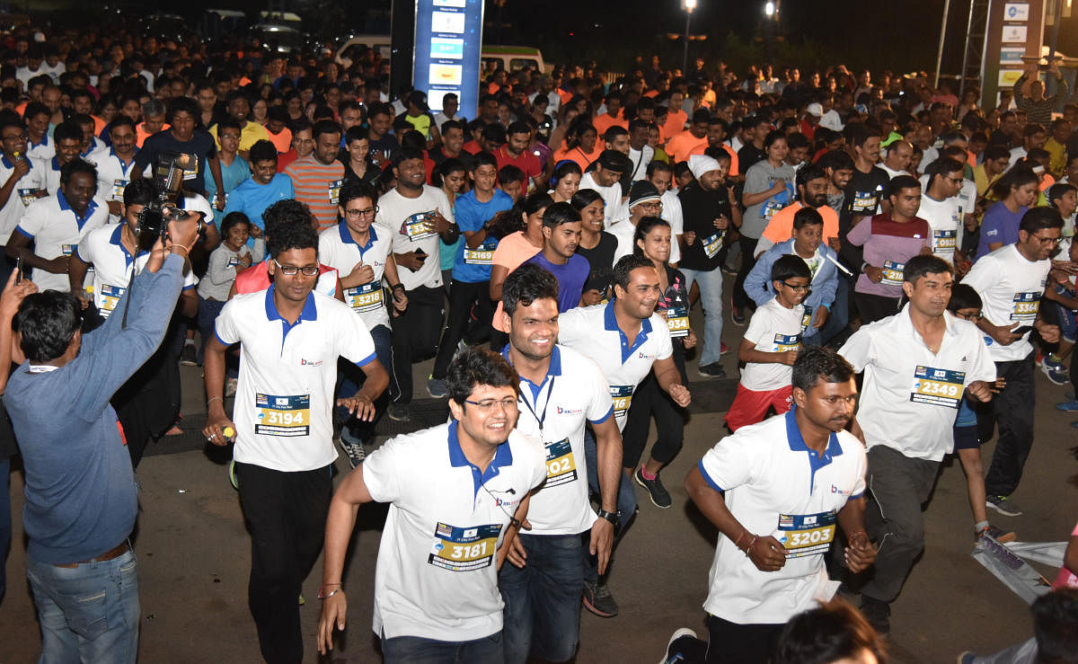 Participants at the 11th edition of Bangalore Midnight Marathon held at ITPO, Whitefield on Saturday night. DH Photo