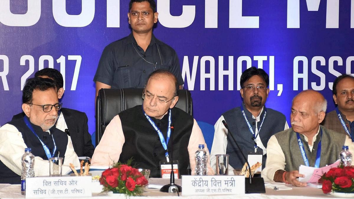 Union Finance Minister Arun Jaitley along with MoS for Finance Shiv Pratap Shukla and Finance Secretary Hasmukh Adhia (L) at the 23rd GST Council Meeting. PTI file photo.