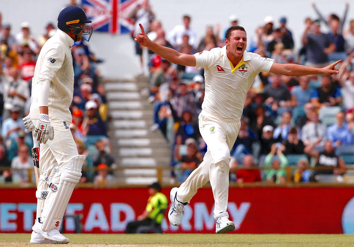 ON FIRE Australia's Josh Hazlewood celebrates after dismissing England's Craig Overton during the third Test on Monday. REUTERS